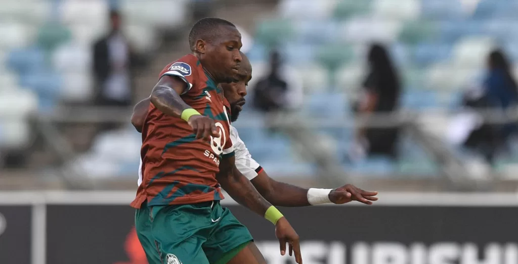 George Maluleka and Makhehlene Makhaula of Orlando Pirates fighting over the ball