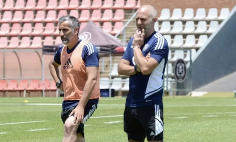 Orlando Pirates coach Jose Riveiro and Scott Chickelday.