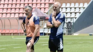 Orlando Pirates coach Jose Riveiro and Scott Chickelday.