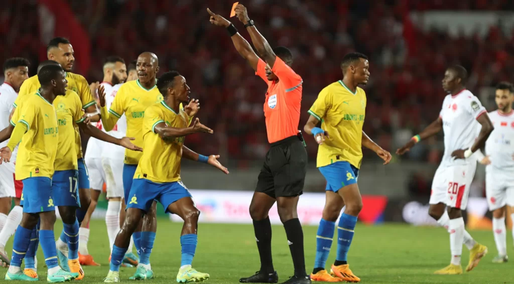 Mamelodi Sundowns players arguing Neo Maema's red card