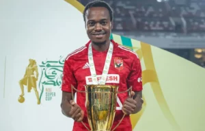 Percy Tau of Al Ahly celebrating after winning a trophy with the club