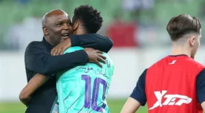Pitso Mosimane celebrating a goal with his player