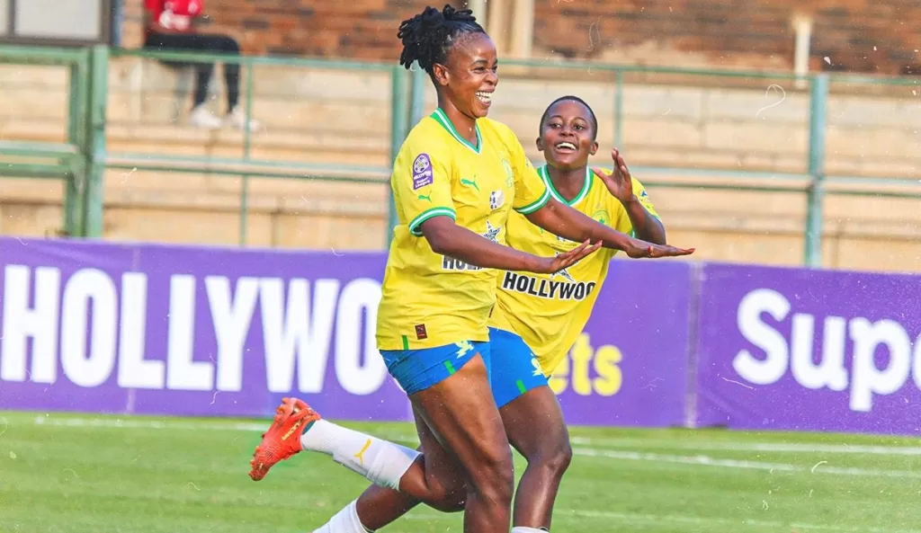 Andisiwe Mcgoyi celebrating her goal with teammate