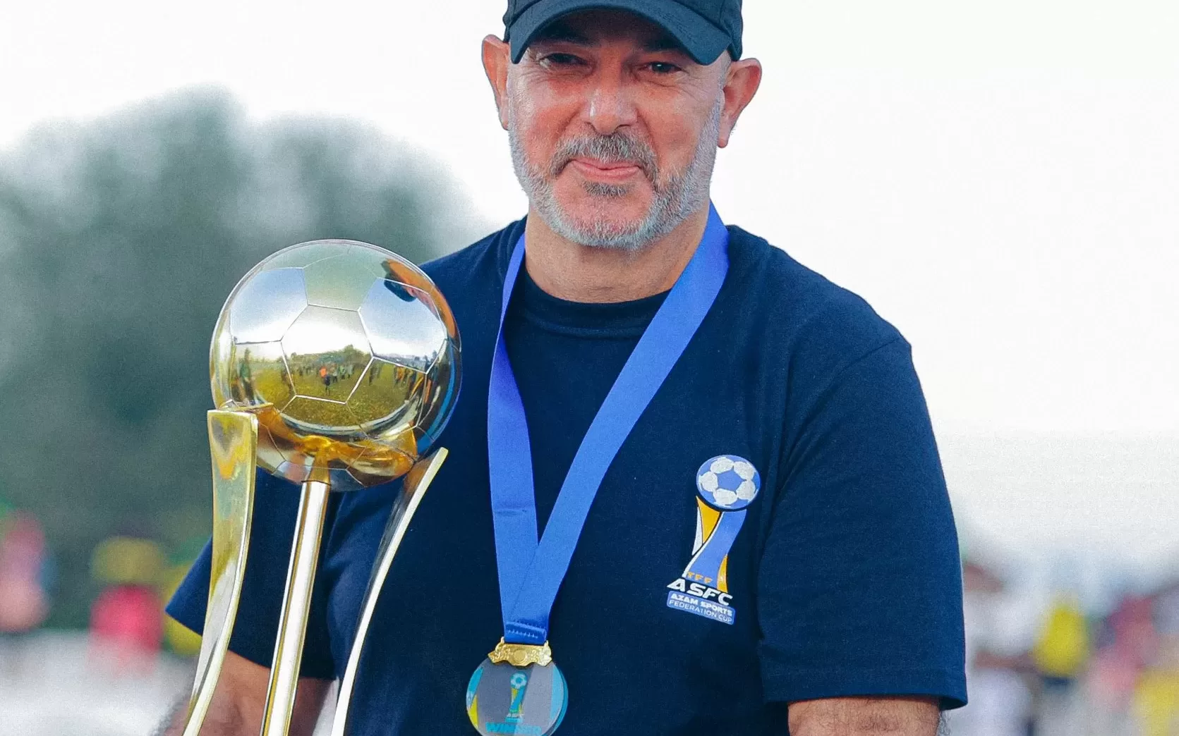 Mohamed Nasreddine Nabi with a trophy he won with Yanga