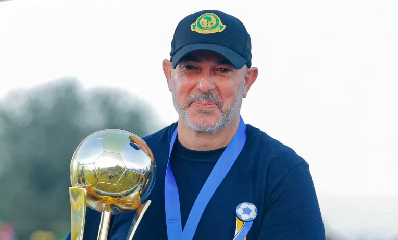 Nasreddine Nabi with a trophy he won with Yanga