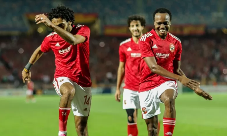 Percy Tau celebrating a goal with his Al Ahly teammate