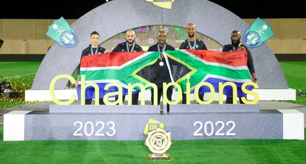 Pitso Mosimane pose for a photo with his technical team