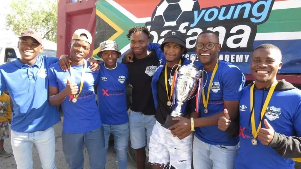 Young Bafana showing off their trophy.