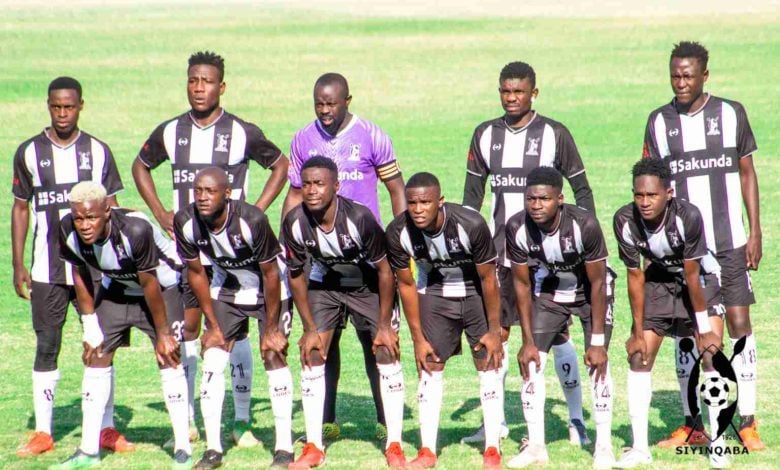 Highlanders FC players pose for photo before a Castle Lager Premier Soccer League match