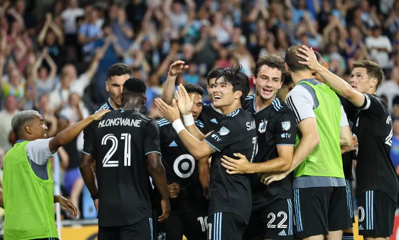 Minnesota United players while celebrating a goal against Portland Timbers.