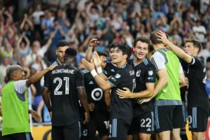 Minnesota United players while celebrating a goal against Portland Timbers.