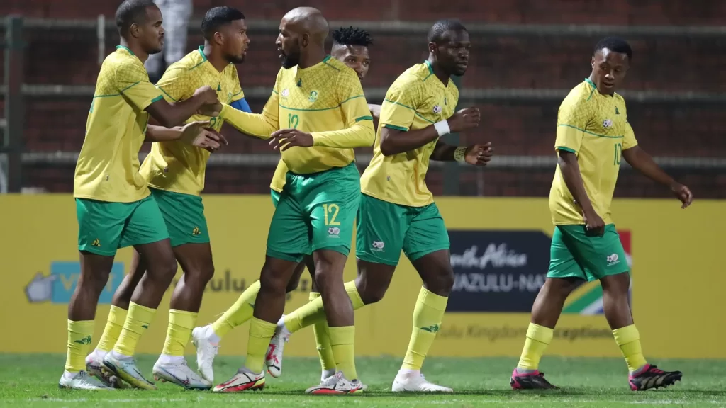 Orlando Pirates' Tshegofatso Mabasa celebrates a goal with Bafana Bafana teammates