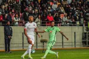Chippa United midfielder Goodman Mosele and Orlando Pirates' Monnapule Saleng in action
