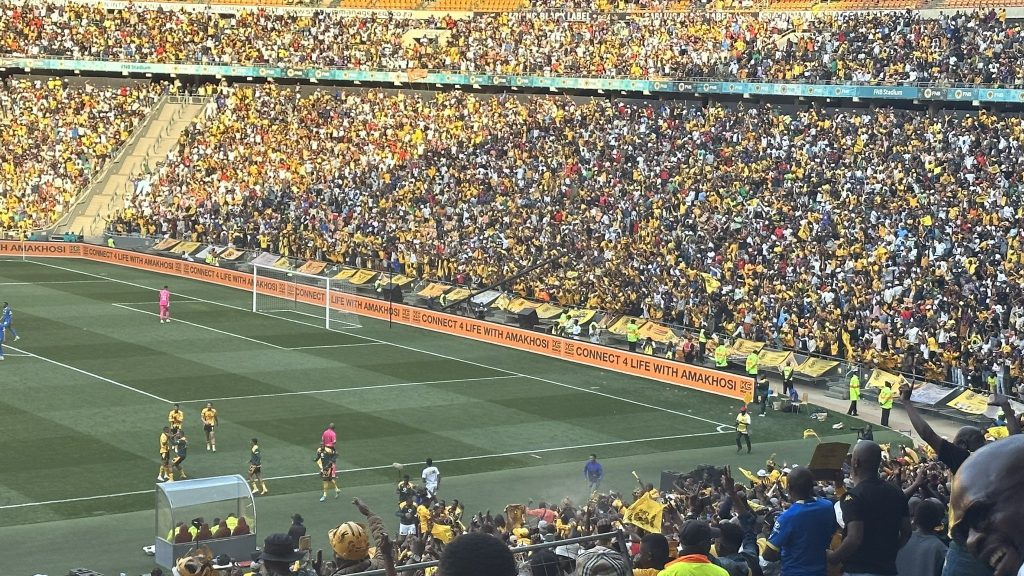 FNB Stadium filled with Kaizer Chiefs and Mamelodi Sundowns fans.