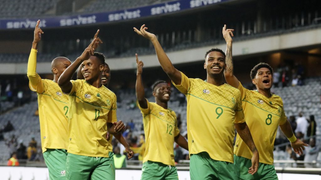 Lyle Foster in celebratory mood with Bafana Bafana players.