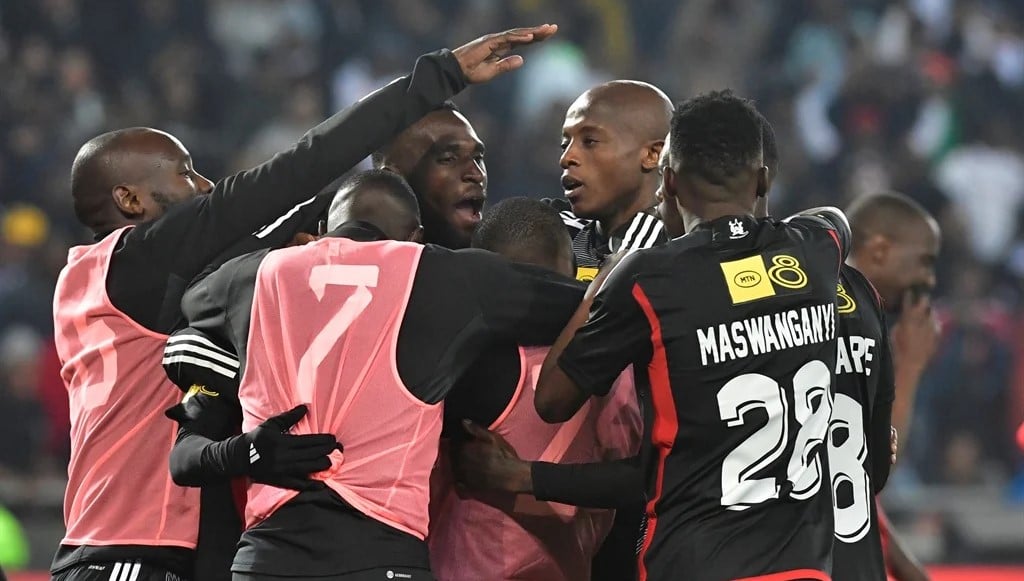 Orlando Pirates' Zakhele Lepasa and Patrick Maswanganyi celebrate a goal with teammates