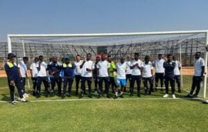 Casric Stars players during a pitch inspection