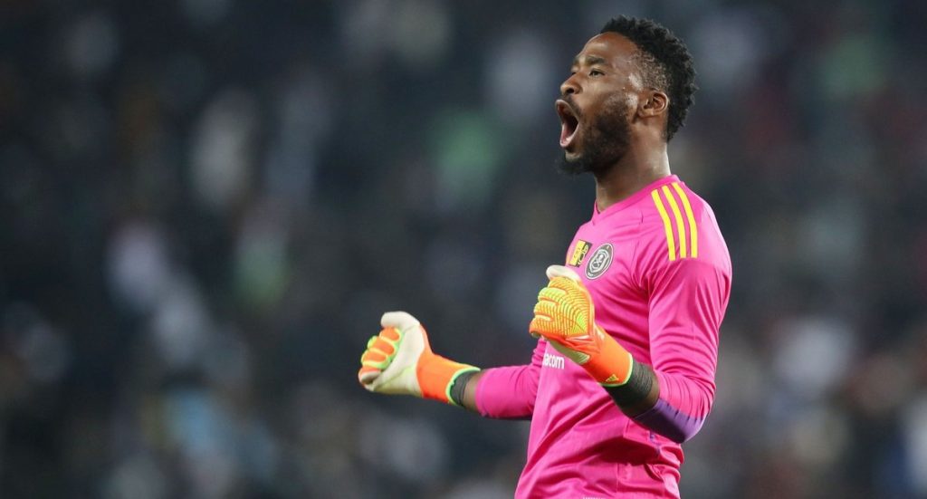 Orlando Pirates goalkeeper Sipho Chaine clebrates after saving a penalty