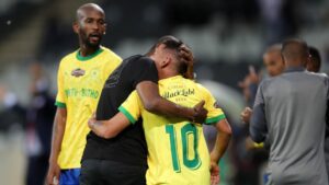 Rulani Mokwena and Gaston Sirino hugging each other.