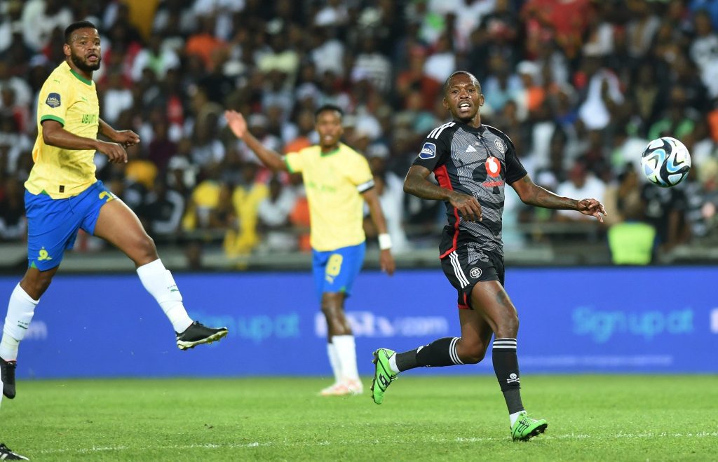 Sundowns' Sipho Mbule and Pirates' Thabang Monare chasing the ball during a league encounter