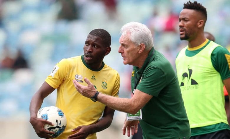 Coach Hugo Broos and Aubrey Modiba in Bafana Bafana colors.