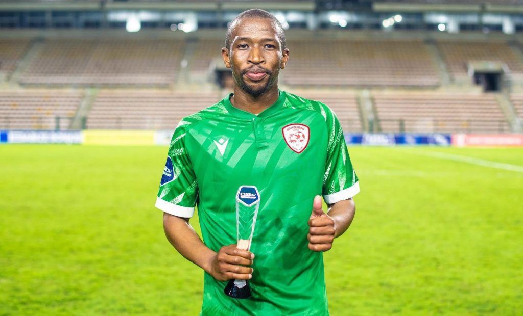 Kamohelo Mokotjo poses with a DStv Premiership Man of the Match