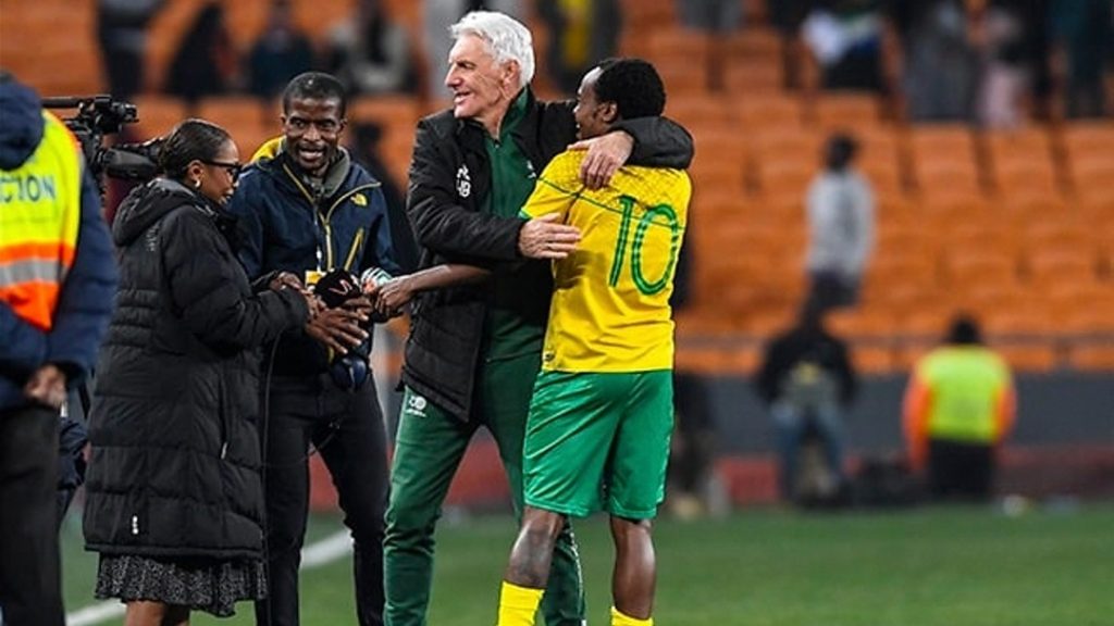 Striker Percy Tau and Bafana Bafana coach Hugo Broos in jubilation mood.