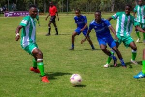 Real Betis Academy players [In green and White] in action