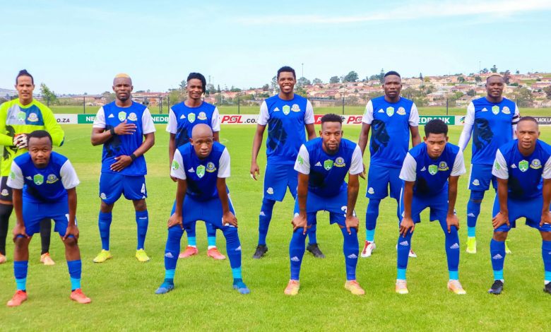 TTM players pose for a team photo before a match