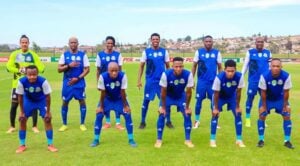 TTM players pose for a team photo before a match
