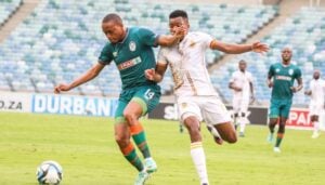 Rian Hanamub protecting the ball from Shaune Mogaila