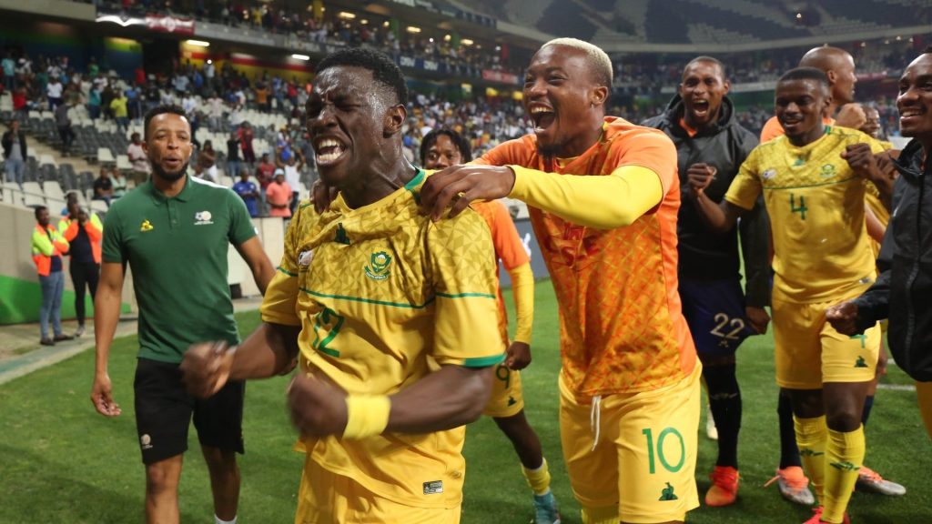 Khanyisa Mayo in celebratory mood with his Bafana Bafana teammates.