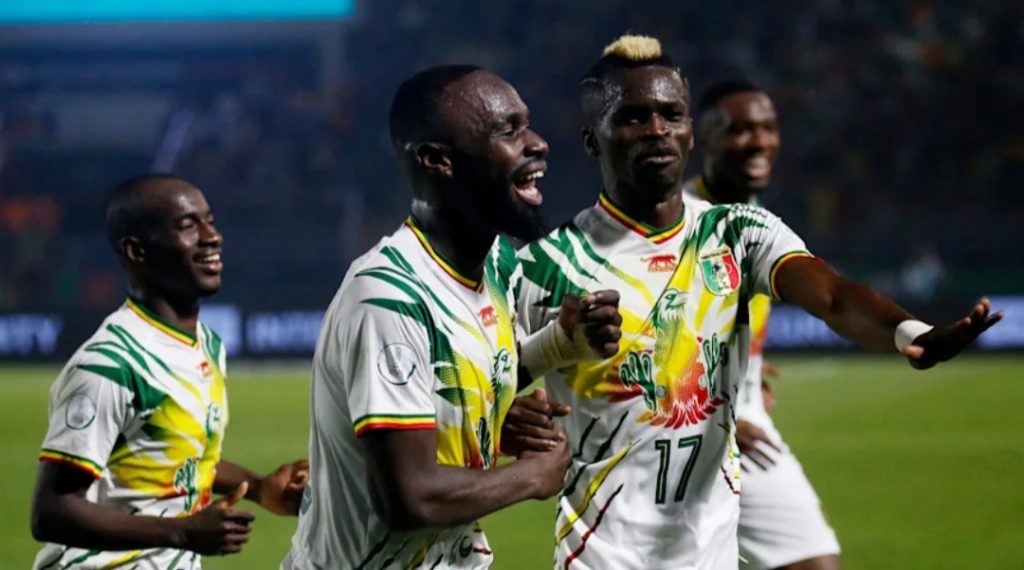 Lassine Sanayoko celebrates with teammates after scoring a goal for Mali