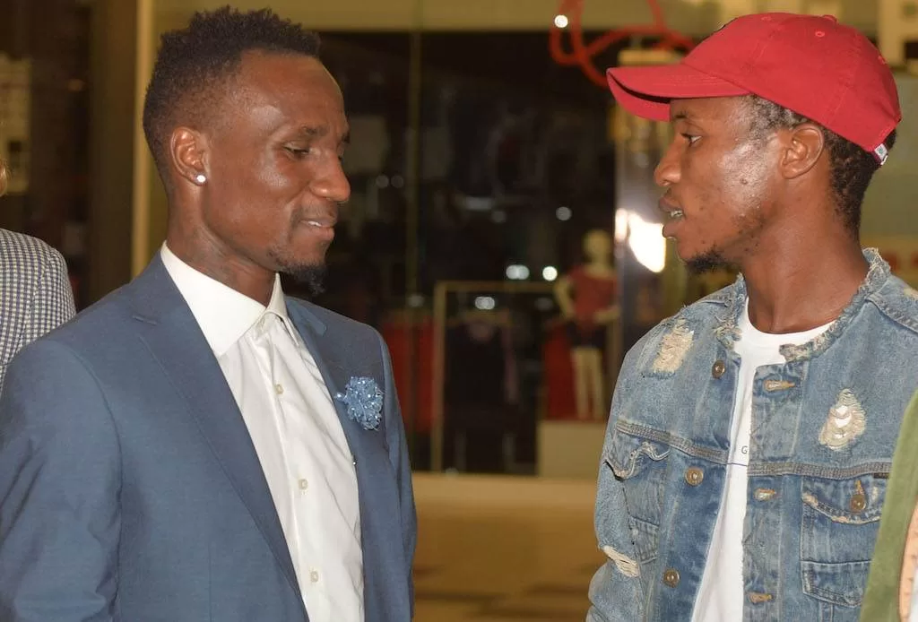 Teko Modise and Themba Zwane having a chat at an event