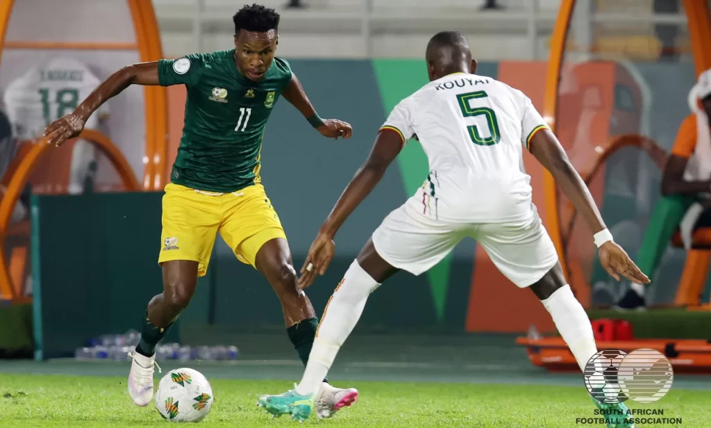 Themba Zwane of Bafana Bafana taking on a Mali player during an AFCON clash