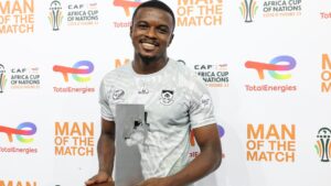 Bafana Bafana midfielder Teboho Mokoena holding his Man of the Match accolade.