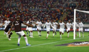 Bafana Bafana players celebrating a goal with Veli Mothwa part of it