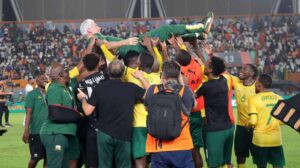 Bafana Bafana players including Teboo Mokoena celebrating Hugo Broos at AFCON