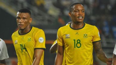 Bafana Bafana defenders Mothobi Mvala and Grant Kekana in action.