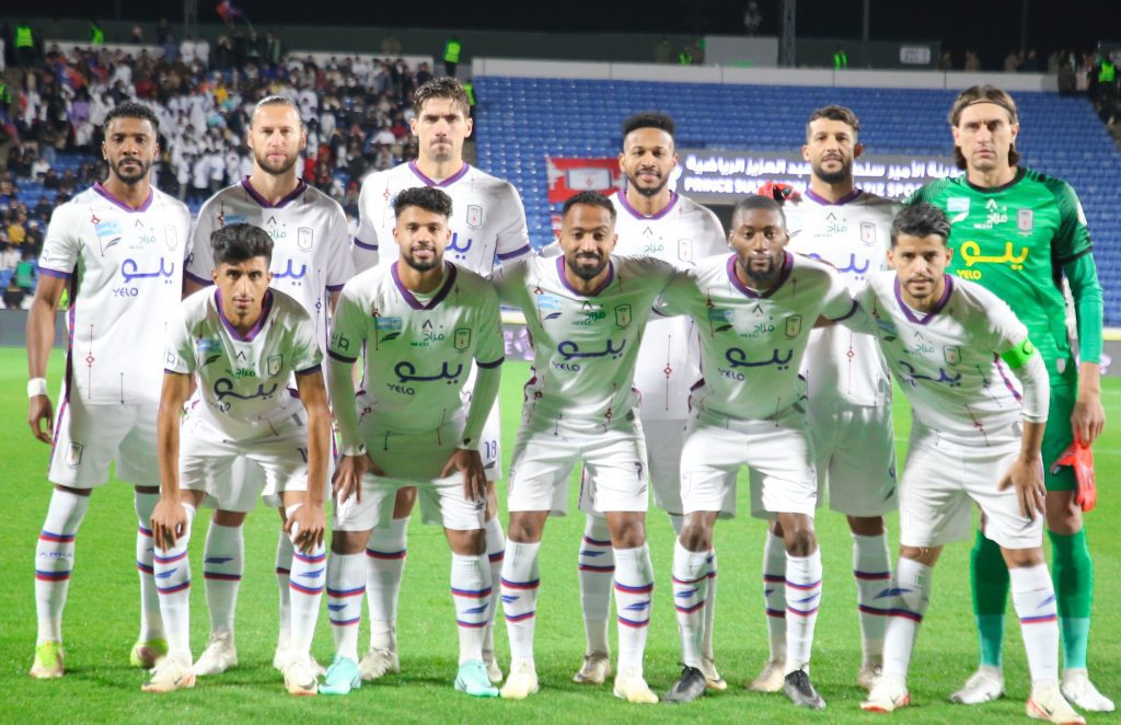 Abha Club players pose for a team photon in the Saudi Pro League