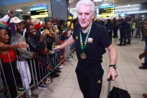 Hugo Broos of Bafana Bafana arriving back in SA