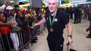 Hugo Broos of Bafana Bafana arriving back in SA