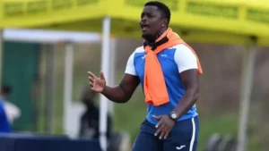Coach Tshepo Motsoeneng on the touchline.