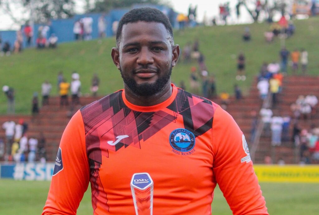 Salim Magoola poses with a Man of the Match award