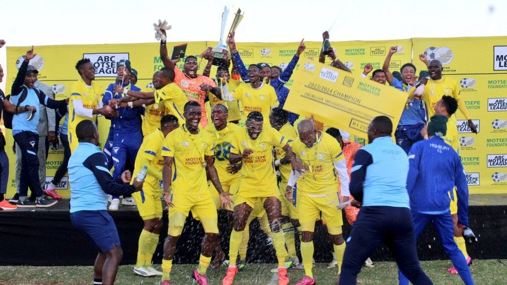 Highbury FC goalkeeper Mlungisi Mazibuko in celebrations with his teammates after gaining promotion to PSL