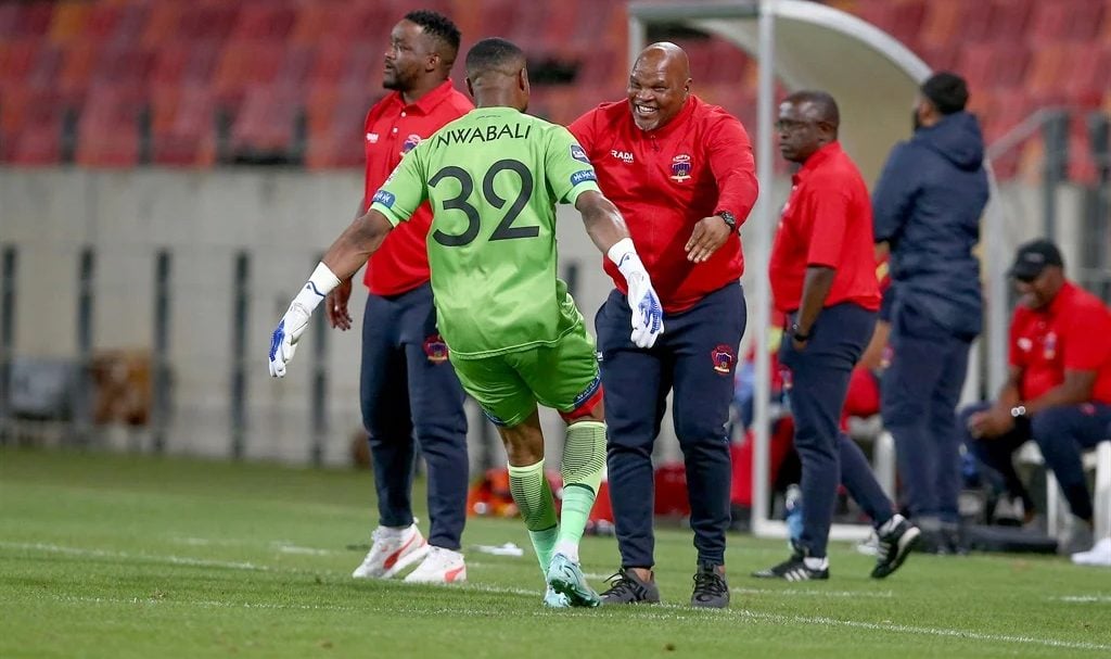 Stanley Nwabali and Morgan Mammila celebrating a goal during a game