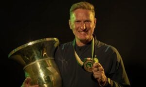 Shawn Bishop poses with a Mamelodi Sundowns trophy