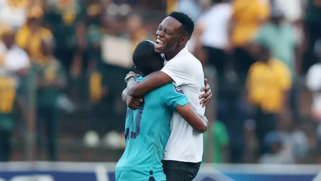 Vusumuzi Vilakazi of Richards Bay FC celebrates with one of his players