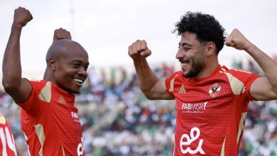 Al Ahly forward Percy Tau and his teammate