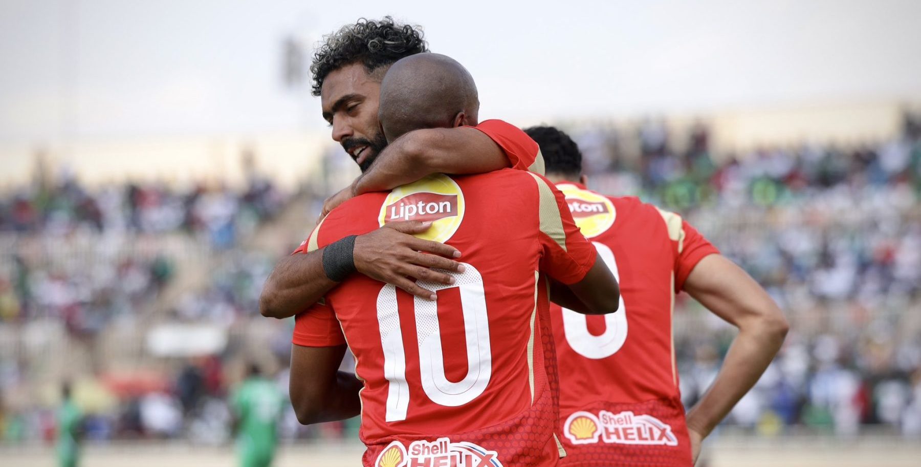 Al Ahly forward Percy Tau and his teammate